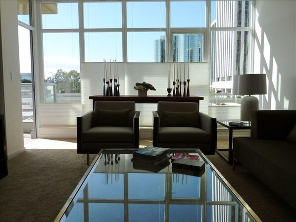 Large Living Room with custom window coverings looking North and West