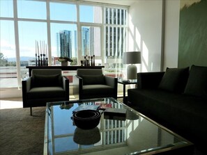 Living Room with custom window coverings and mid-century furnishings