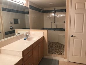 A spacious 2 sink Master Suite bathroom with newly remodeled dual head shower