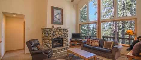 Living room with stone fireplace