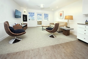 The spacious living room has wonderful views and comfortable seating