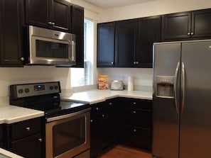 Completely renovated kitchen with new appliances, counter tops and cabinets