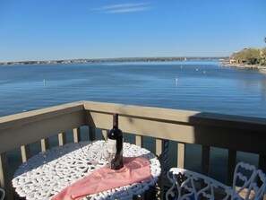 Cocktails on the middle level balcony with view of Lake LBJ at Horseshoe Bay, TX