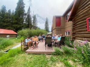 Back deck with table, chairs, gas grill and amazing views plus lots of space.