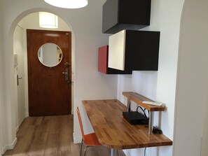 Welcoming foyer with a cheerful laptop workspace