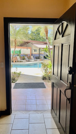 Looking out the front condo entrance to the pool.