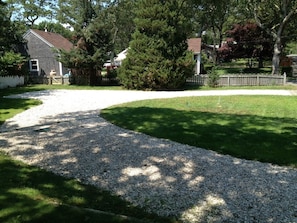 Large driveway with plenty of lawn space