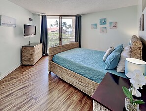 Enjoy the views of the tropical palms swaying outside your lanai doors.