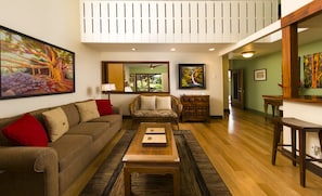 Living area looking towards bedroom and entry