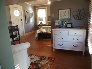 This door, located in the bedroom, leads to the back porch