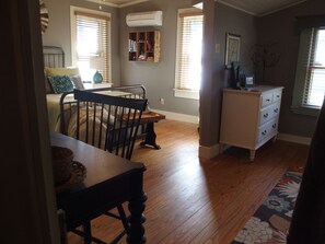 the bedroom offers a dresser and a closet for clothes. 