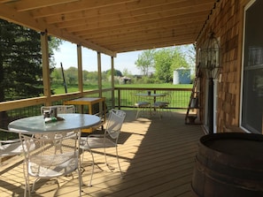 Walk out covered deck with seating for 8.