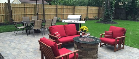 Private fenced backyard with patio, grill, fire pit.  Hear the ND band and bells