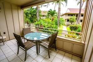 Relax and take in stunning views from this spacious lanai, perfect for outdoor lounging.