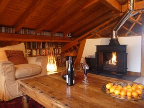 The log fire lit in the beautiful living room