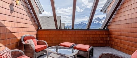 There is no better place to relax and enjoy a view of the Three Sisters than this private rooftop deck with comfortable seating for the whole family (and a hot tub!). 