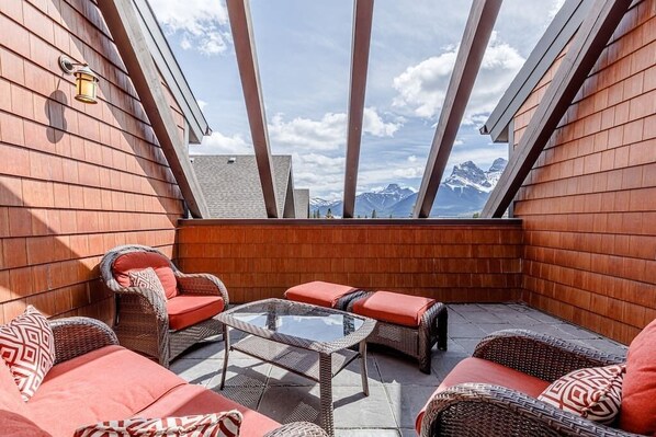 There is no better place to relax and enjoy a view of the Three Sisters than this private rooftop deck with comfortable seating for the whole family (and a hot tub!). 