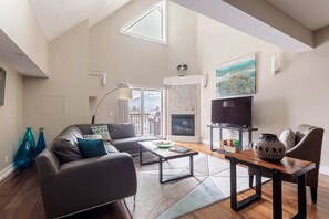 Spacious light-filled living room with lofted ceilings and wonderful mountain views