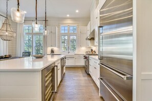 Chefs Kitchen features Quartz counter tops, Sub Zero Refrigerator, Wolf Range & Ice Maker