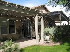 The entire back of home has a covered patio for restful afternoons