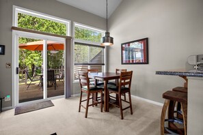 Large Windows and glass door to the back deck