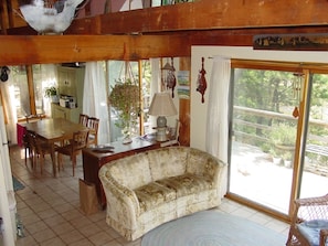 Kitchen, dining, living area with deck