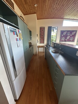 Galley kitchen at back of living room