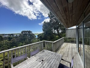 Deck with bush and harbour view