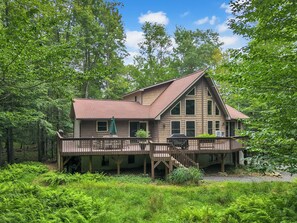 Our beautiful home surrounded by nature in the summer.