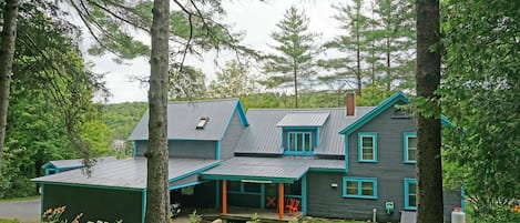 Rear of the house with carport and your entry door. 