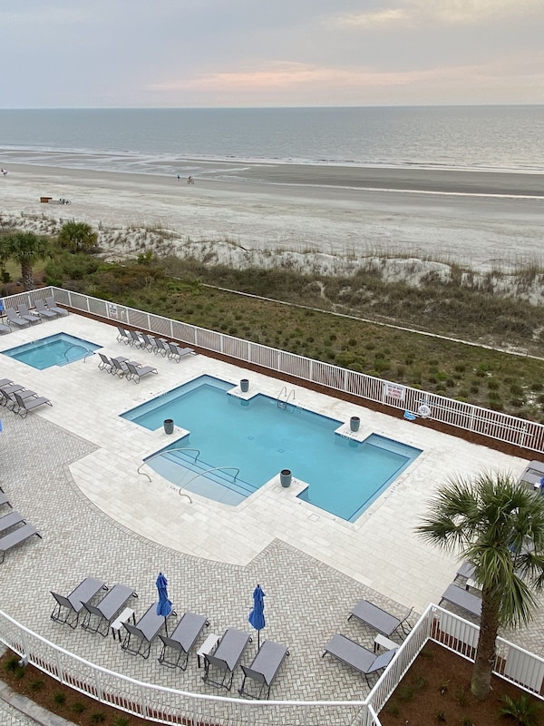 New Serenity pool and hot tub with beach view.