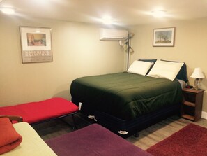 Queen size bed, cot, and two Trundle twin sized beds

