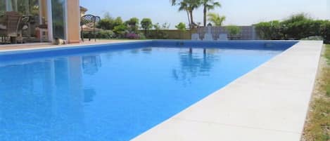 Large private pool in the gardens next to the villa