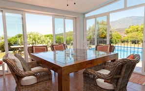 Inside dining area - just off the kitchen with views over the pool