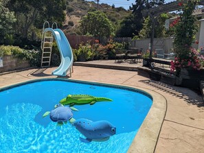 Secluded yard with lots of hillside views. Waterslide is ever popular!