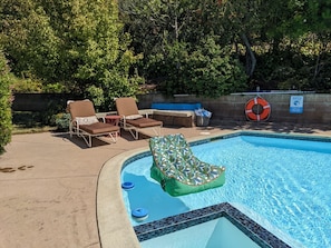 Attached hot tub/spa, pool floats, lounge chairs, pool safety devices.