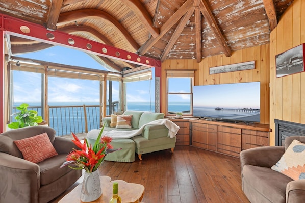 Living room with large flat screen TV and amazing views