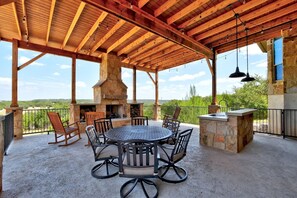 Outdoor patio addition with kitchen and gas grill 