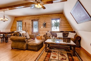 The cabin is decorated in luxurious mountain decor and finished with beautiful custom wood work.