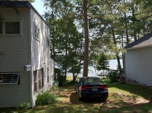 South side of cabin with driveway. Looking toward lake.