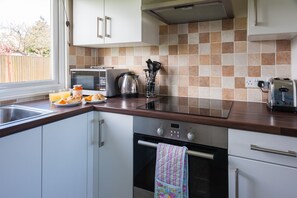 The kitchen - equipped to cook or bring in fish and chips!