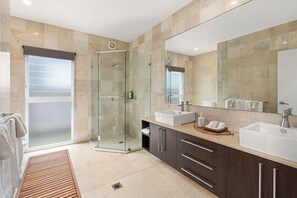 Large bathroom with double sinks.
