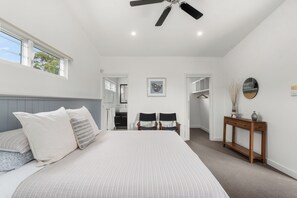 Master king bedroom with ensuite, walk-in-robe, ceiling fan and wall mounted TV.