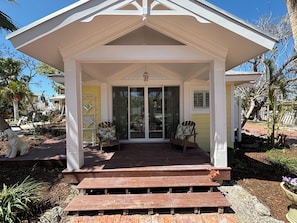 Front of Cottage, deck off the front with sliding glass doors.