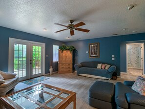 Living room North East view. 2 sofas,  love seat, 2 lounge chairs, TV