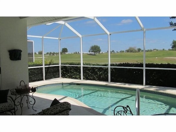 Pool area & lanai with view of golf course