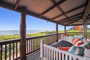 Relax with a book on the daybed. Listen to the waves breaking and watch the surfers - you might even spot a whale or two, at the right time of year! (August-November)