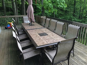 Outside dining on lakeside deck that seats 12