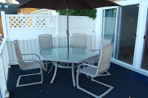 Deck with table, chairs, umbrella