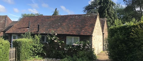 C18th brick and stone former farm building